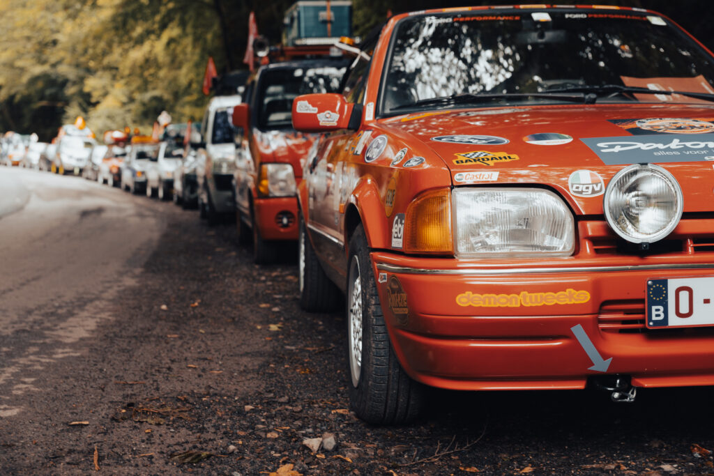 We drove a 35 year old car on the Budapest rally and failed, here’s what I learned 4 Multiple cars of the Budapest rally parked on the side of the road.